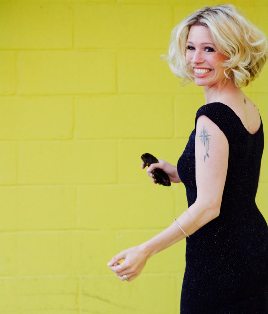 navy dress yellow wall