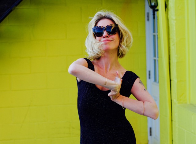 bright yellow wall navy dress