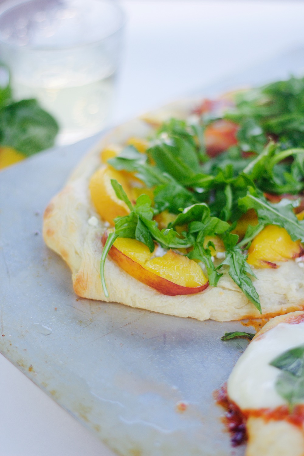 homemade pizza peach arugula