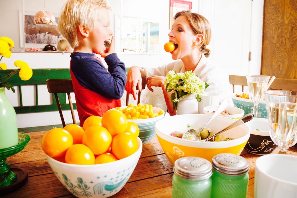 Blogger Jordan Reid and son at home with retro inspired table decor