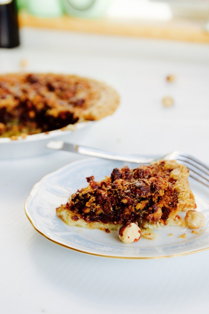 A slice of chocolate hazelnut crostata on a blue and white plate