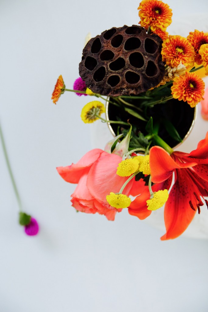 Red, yellow and pink flowers on a white background
