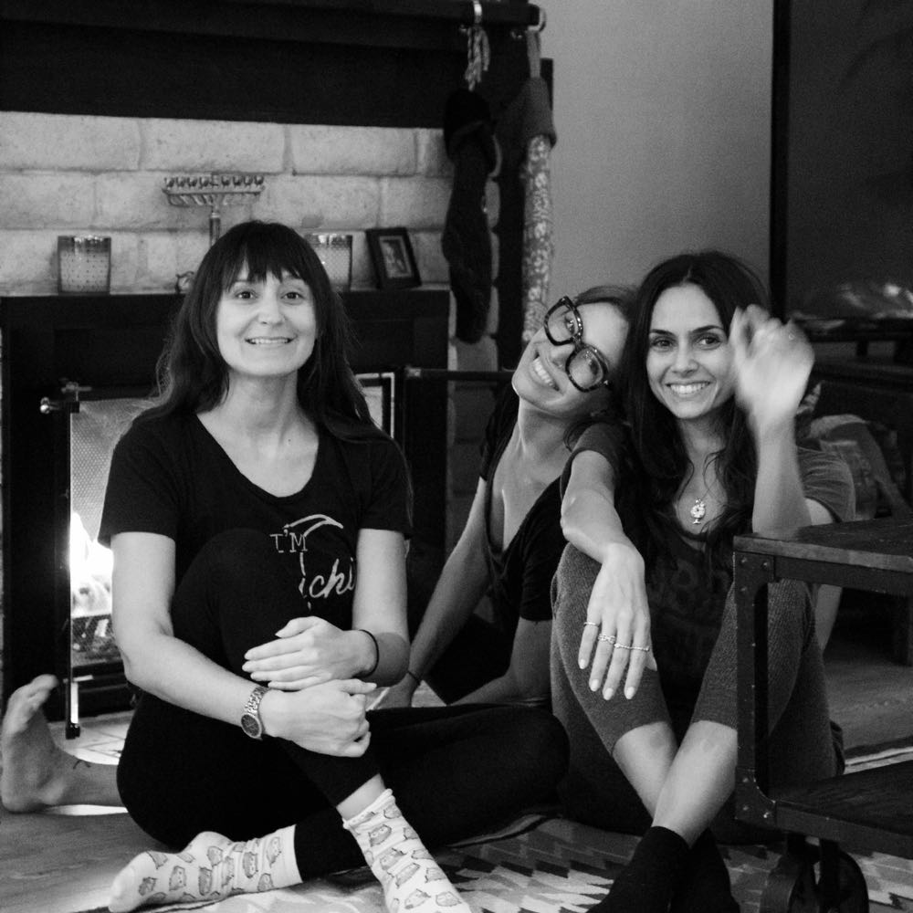 Black and white photograph in front of fireplace with holiday decorations