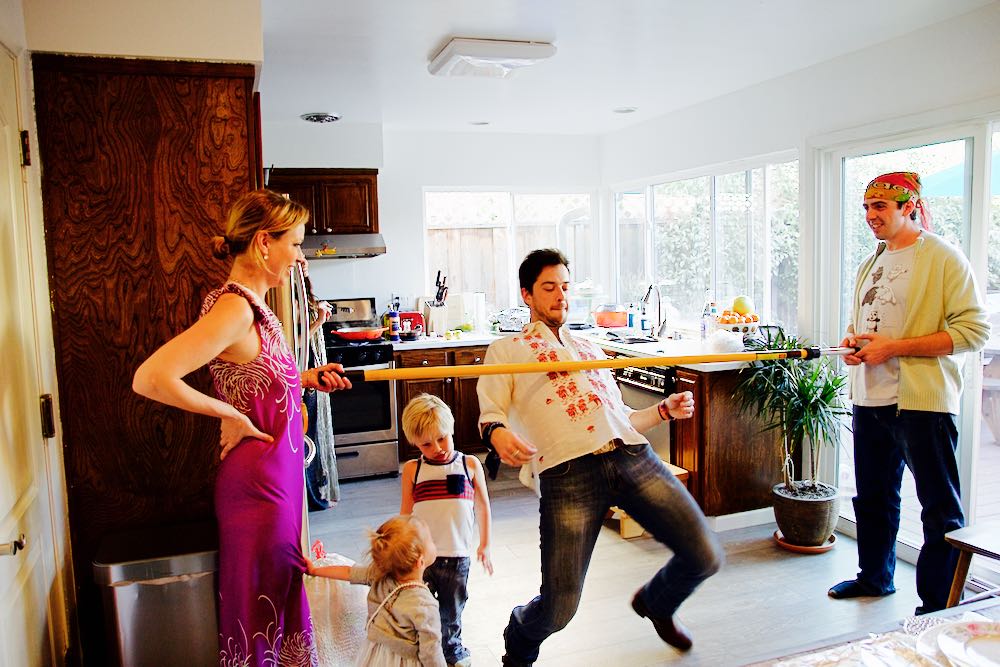 Playing limbo at home during a party