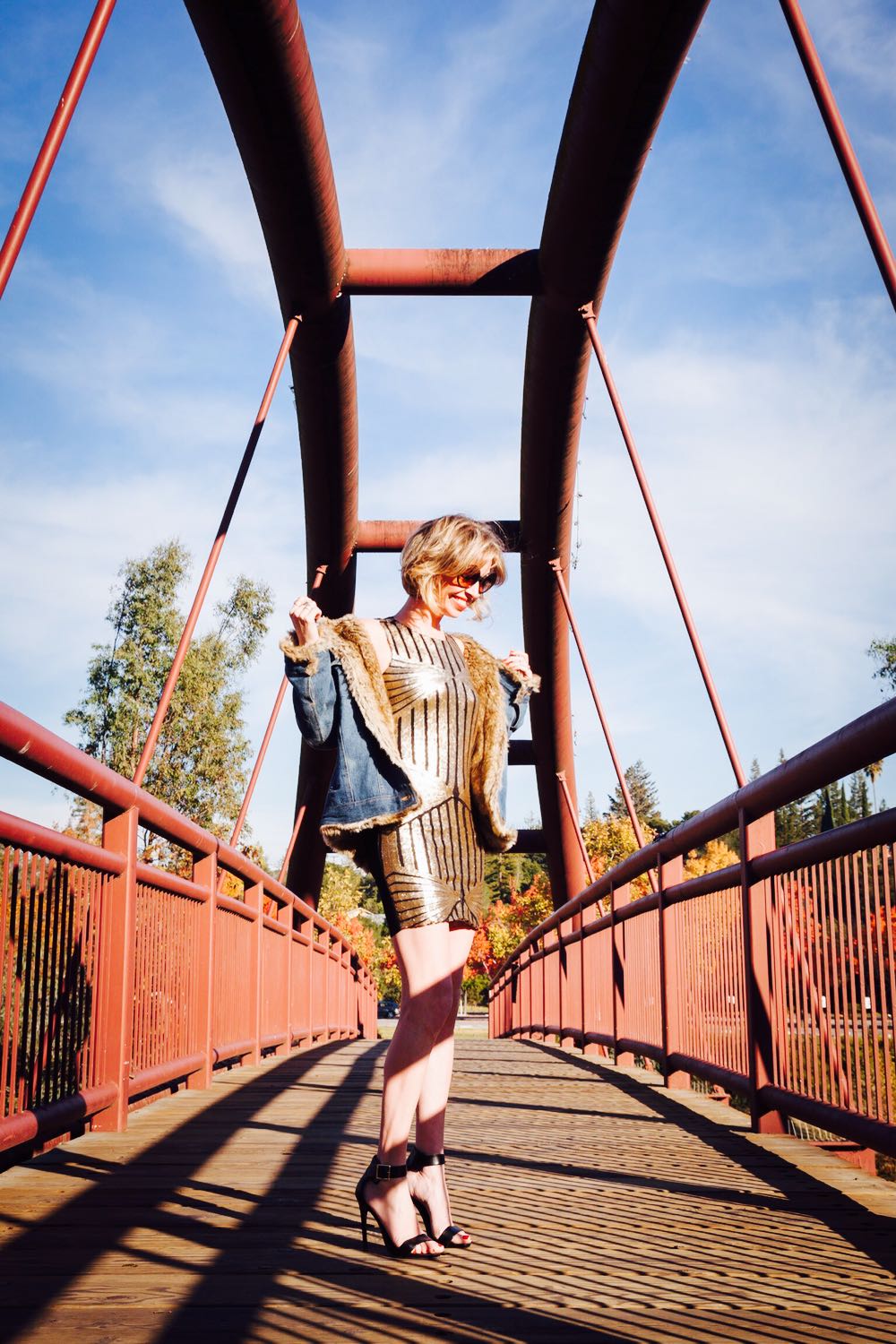 Jordan Reid in a gold dress by Modcloth and a vintage denim jacket