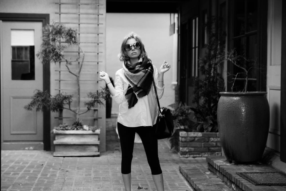 Black and white image of a white shirt and black leggings