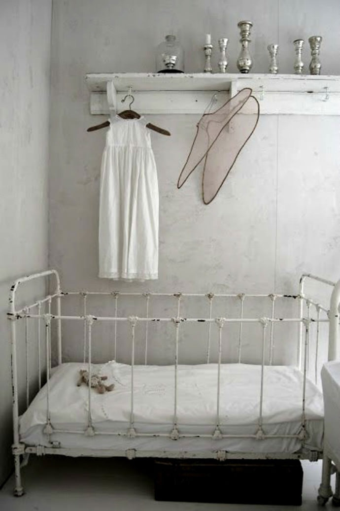 victorian inspired nursery with clean white colors