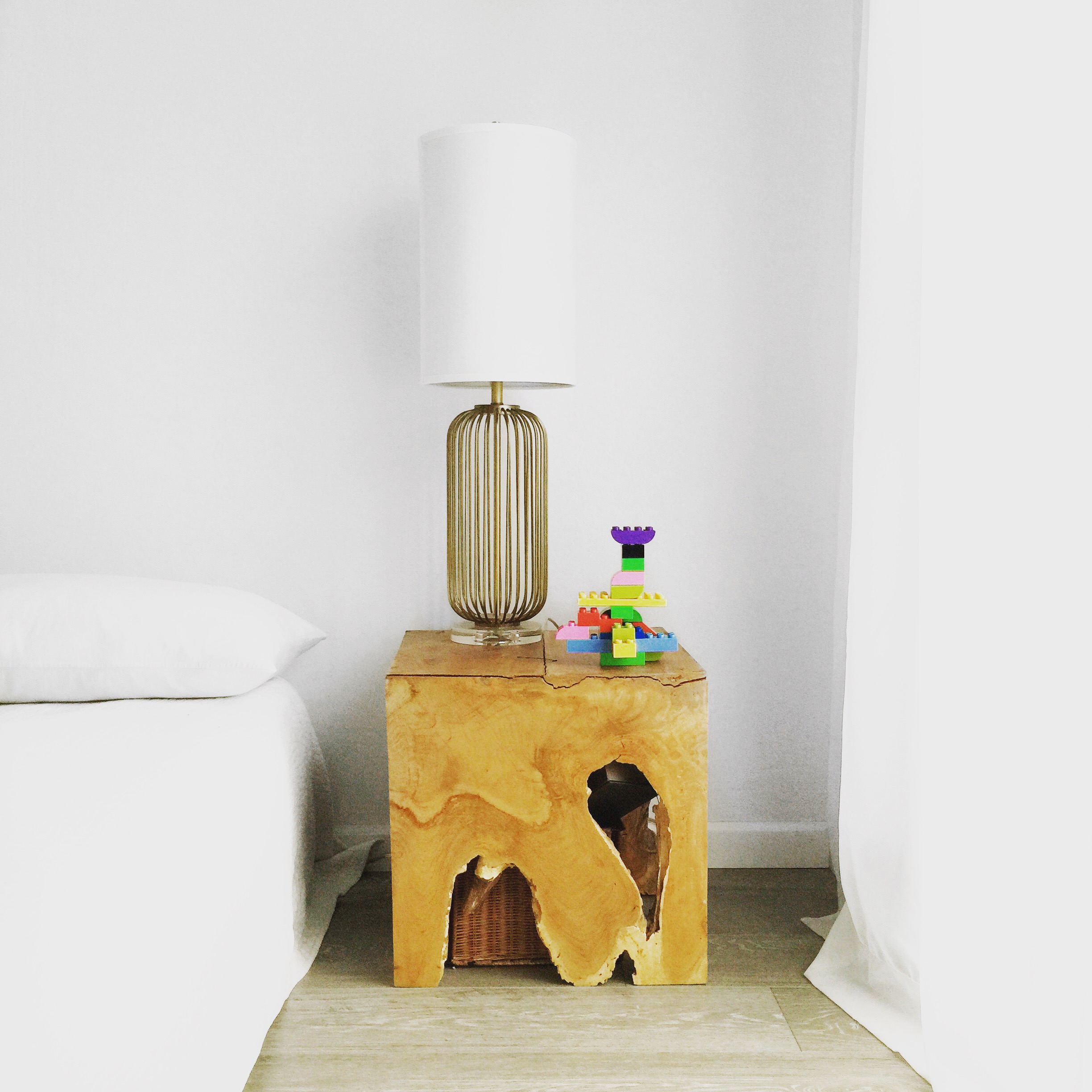 Reclaimed natural teak wood end tables with midcentury modern lamp