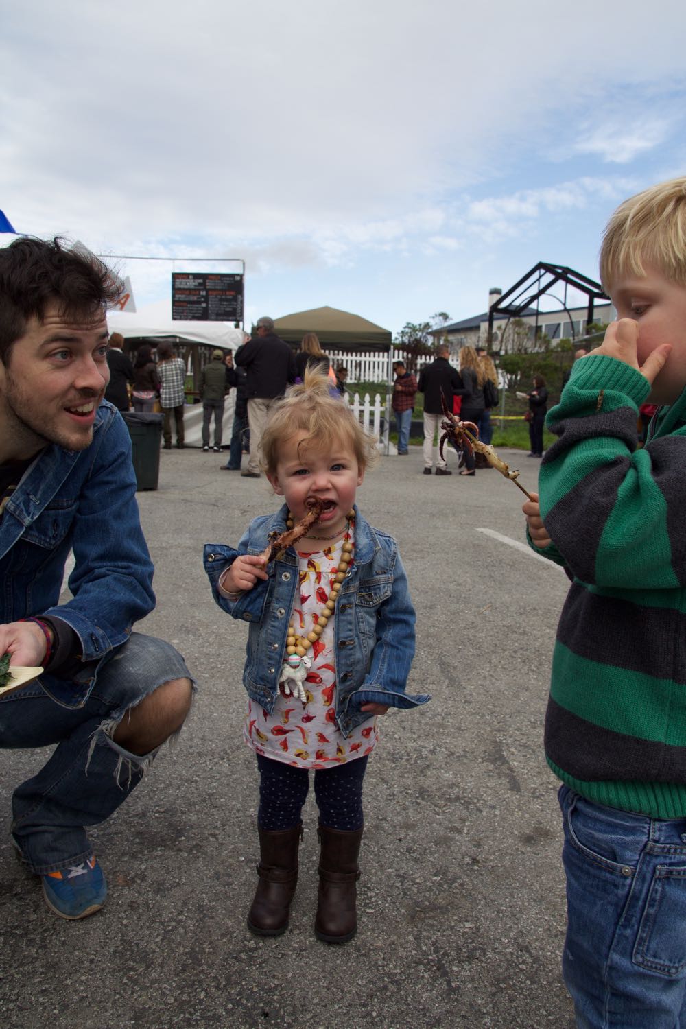 Kids eating octopus tentacles
