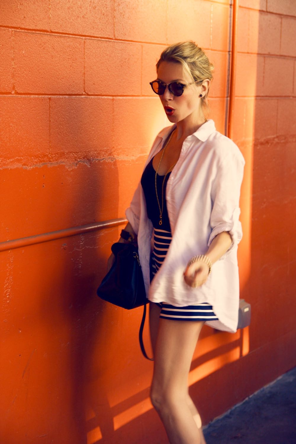 White shirt with blue and white striped shorts