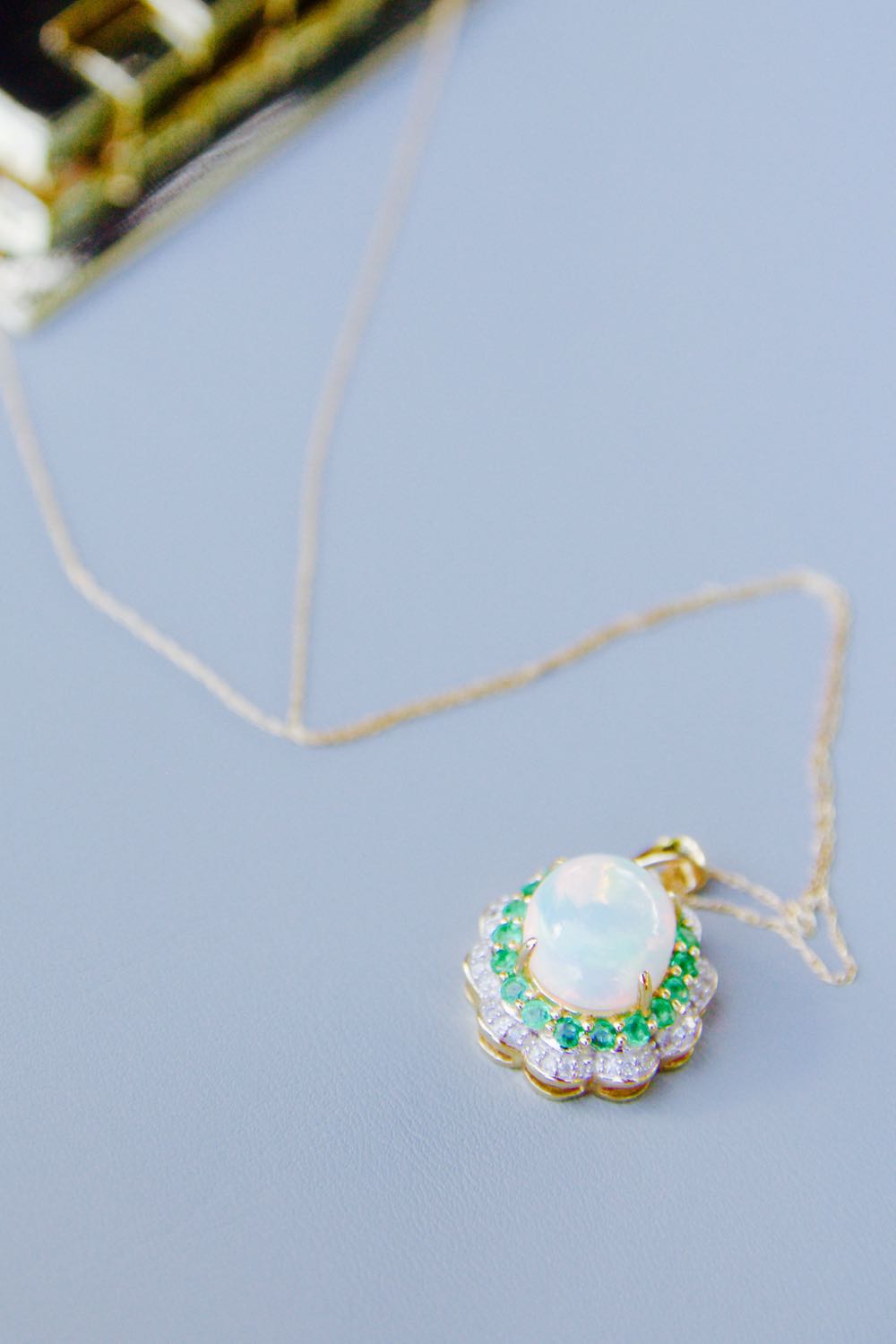 Opal necklace with diamonds and emeralds for a giveaway