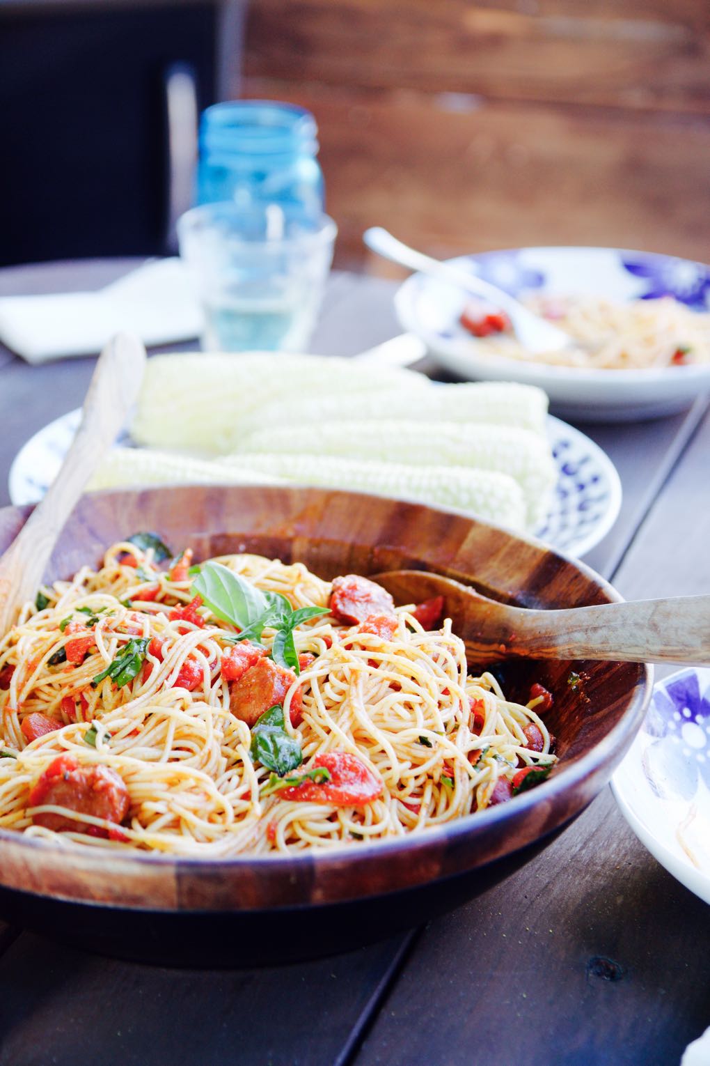 Spaghetti with linguica sausage, tomatoes and basil