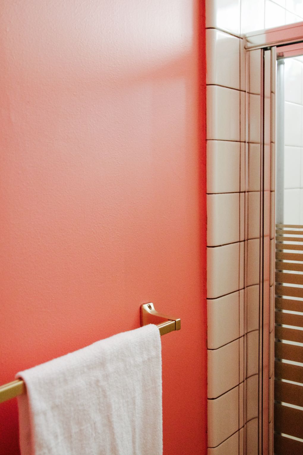 retro pink bathroom with gold accents