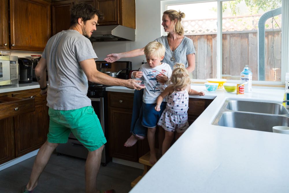 family making pancakes in the kitchen