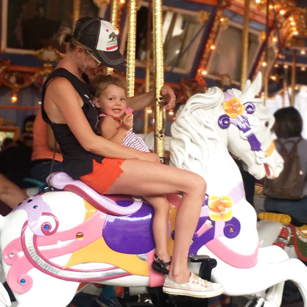 riding the carousel at disneyland