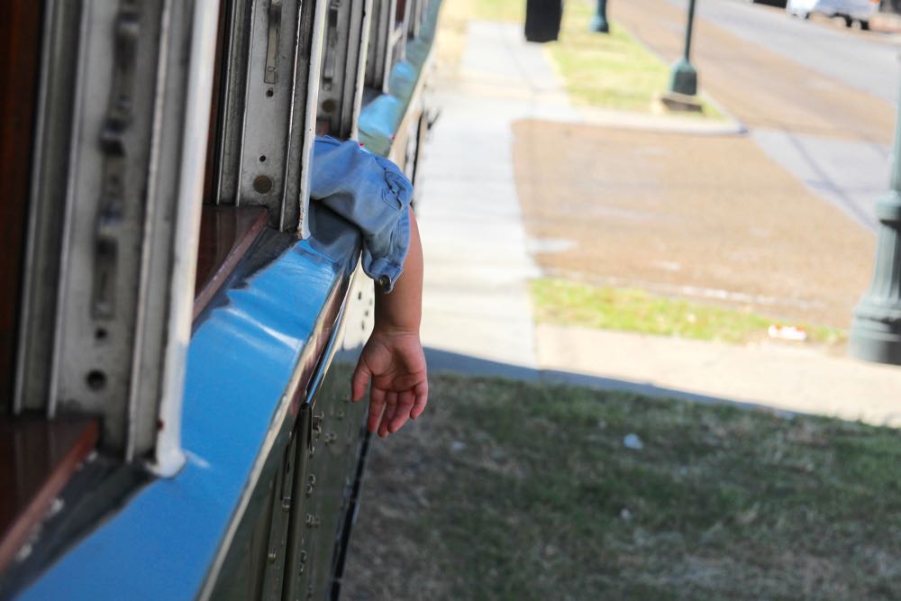 children riding a streetcar in new orleans