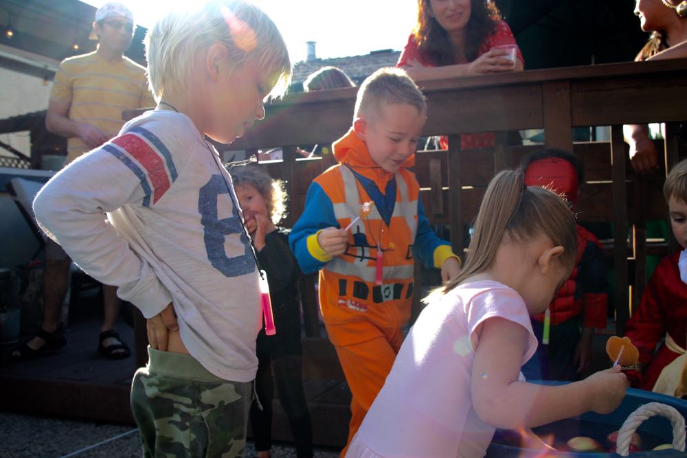 Activity ideas for a kids Halloween party including bobbing with apples
