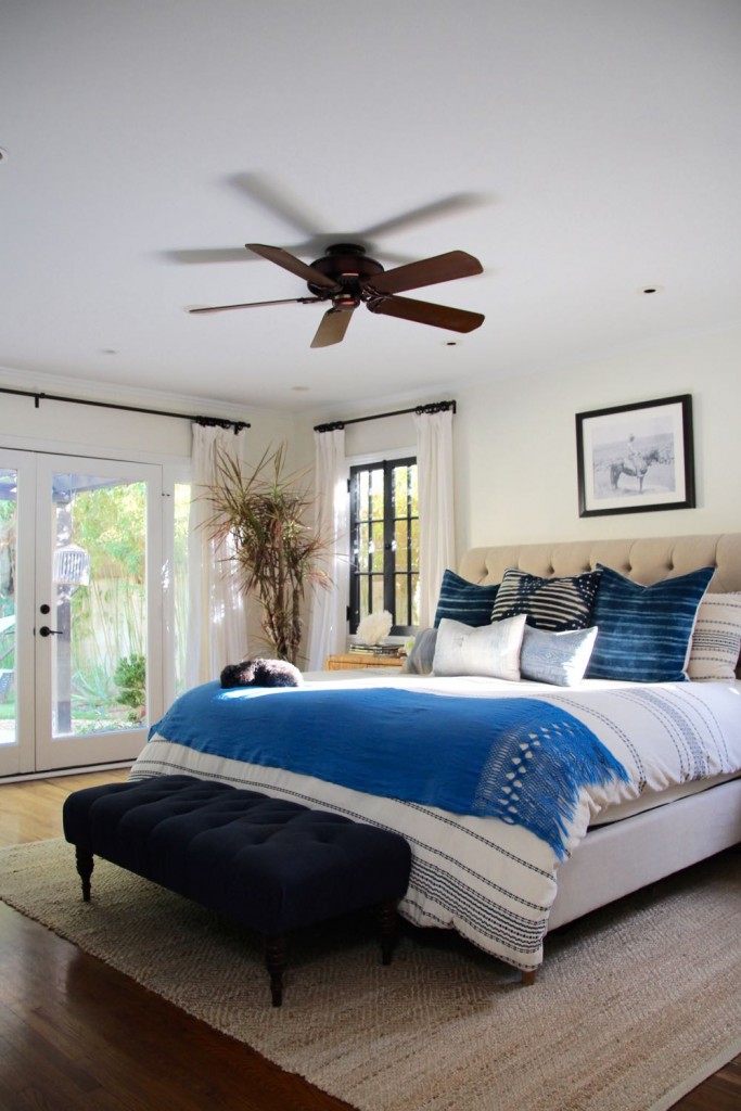 Clean and modern master bedroom with white and blue