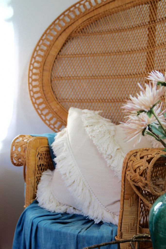 Oversize '70s era chairs with white tassel pillows
