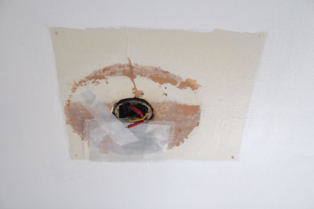 how to repair a medium sized hole in drywall step by step