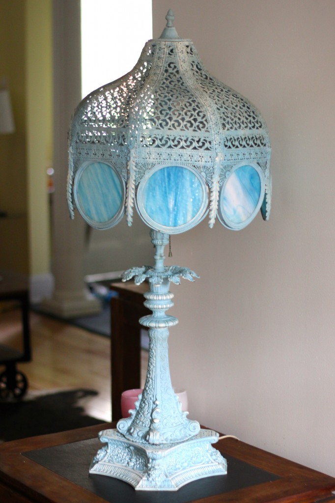 large wrought iron base lamp with translucent blue glass panels