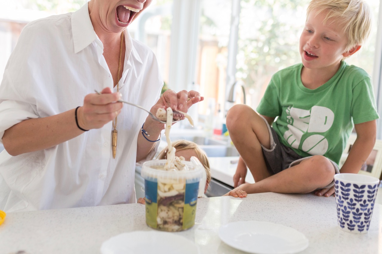 children eating raw octopus and squid