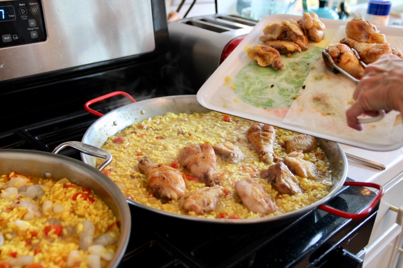 homemade chicken paella with boiled eggs and pancetta