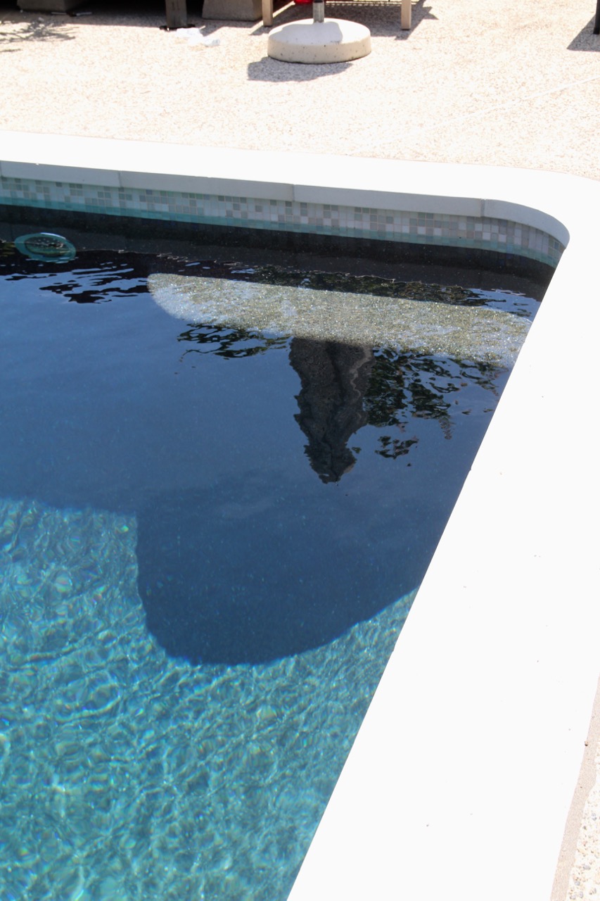 flat white coping with bench in pool