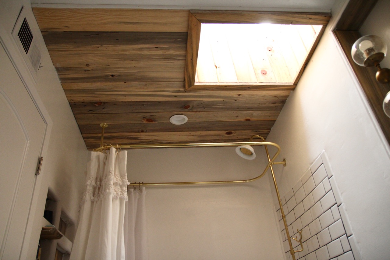reclaimed wood details in black and white bathroom