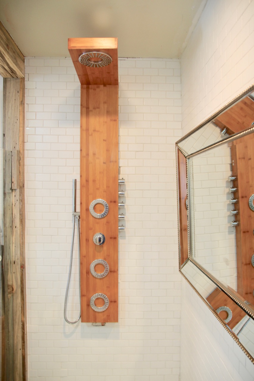 bathroom renovation with thermostatic shower panel and mint tile
