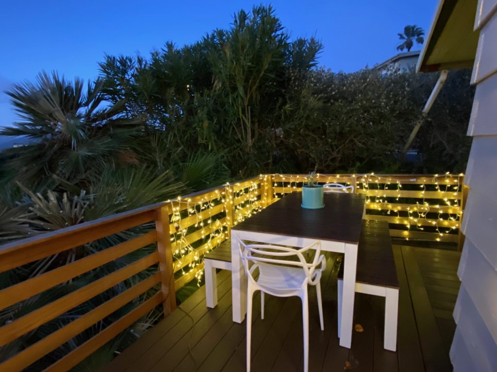 dark wood white base outdoor dining table with benches