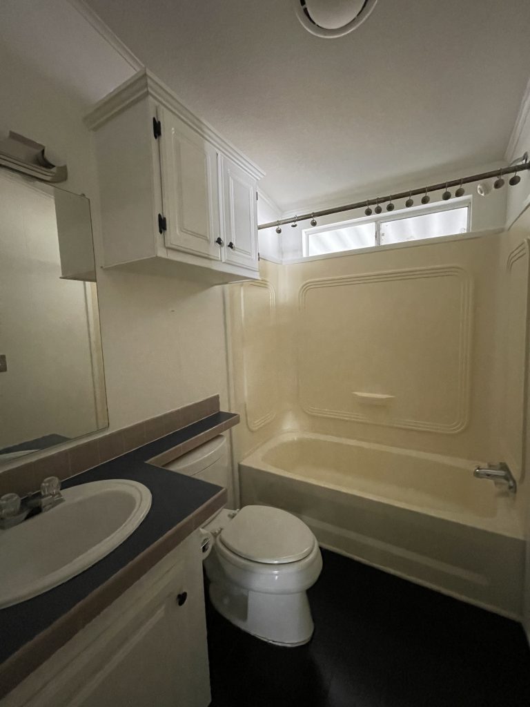 before and after dated hallway bathroom