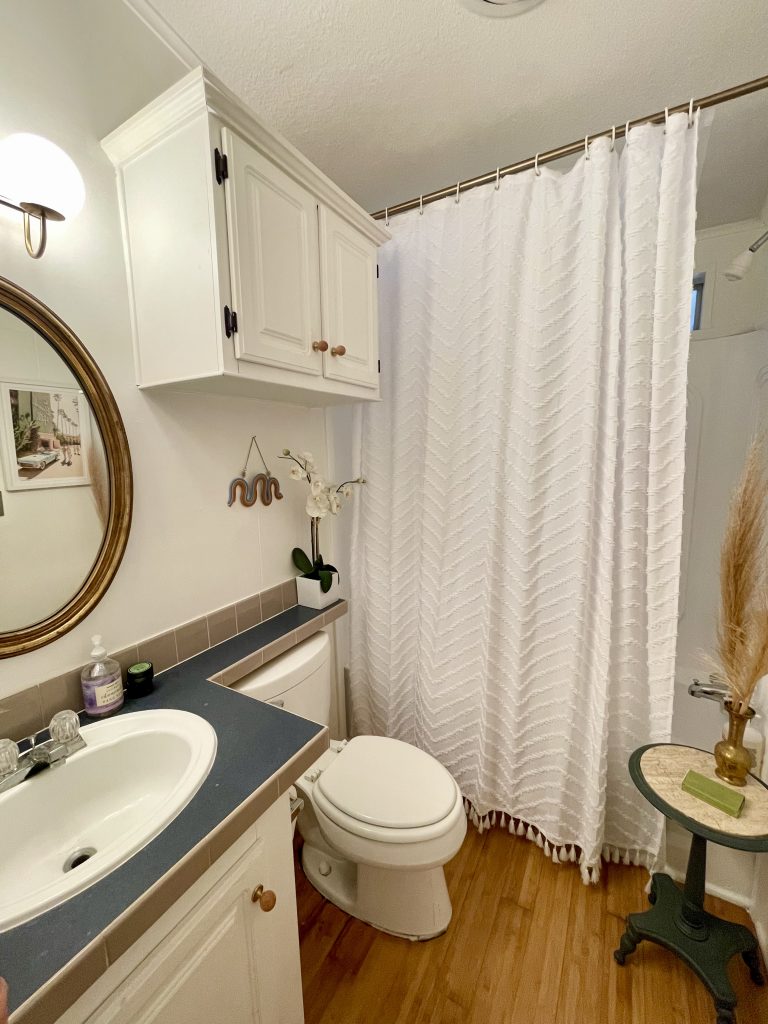 before and after dated hallway bathroom